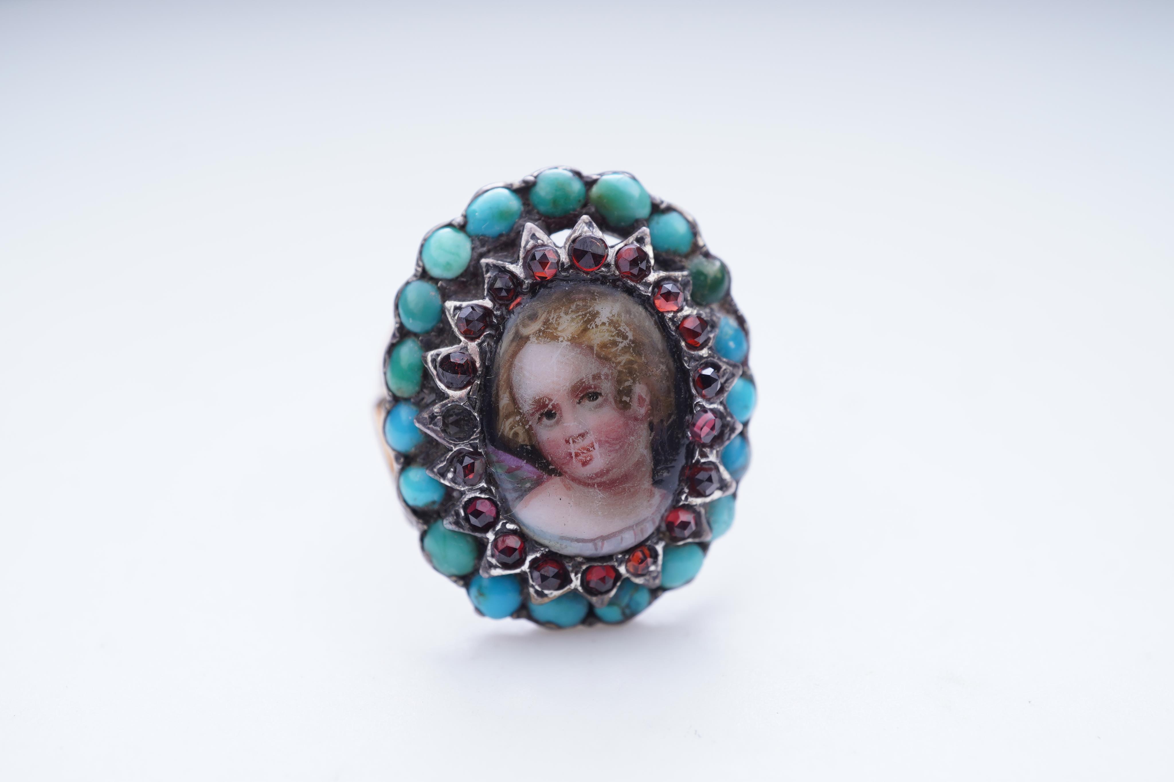 An enamel miniature, turquoise and garnet ring